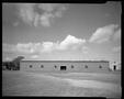 Photograph: [Warehouse in a field]