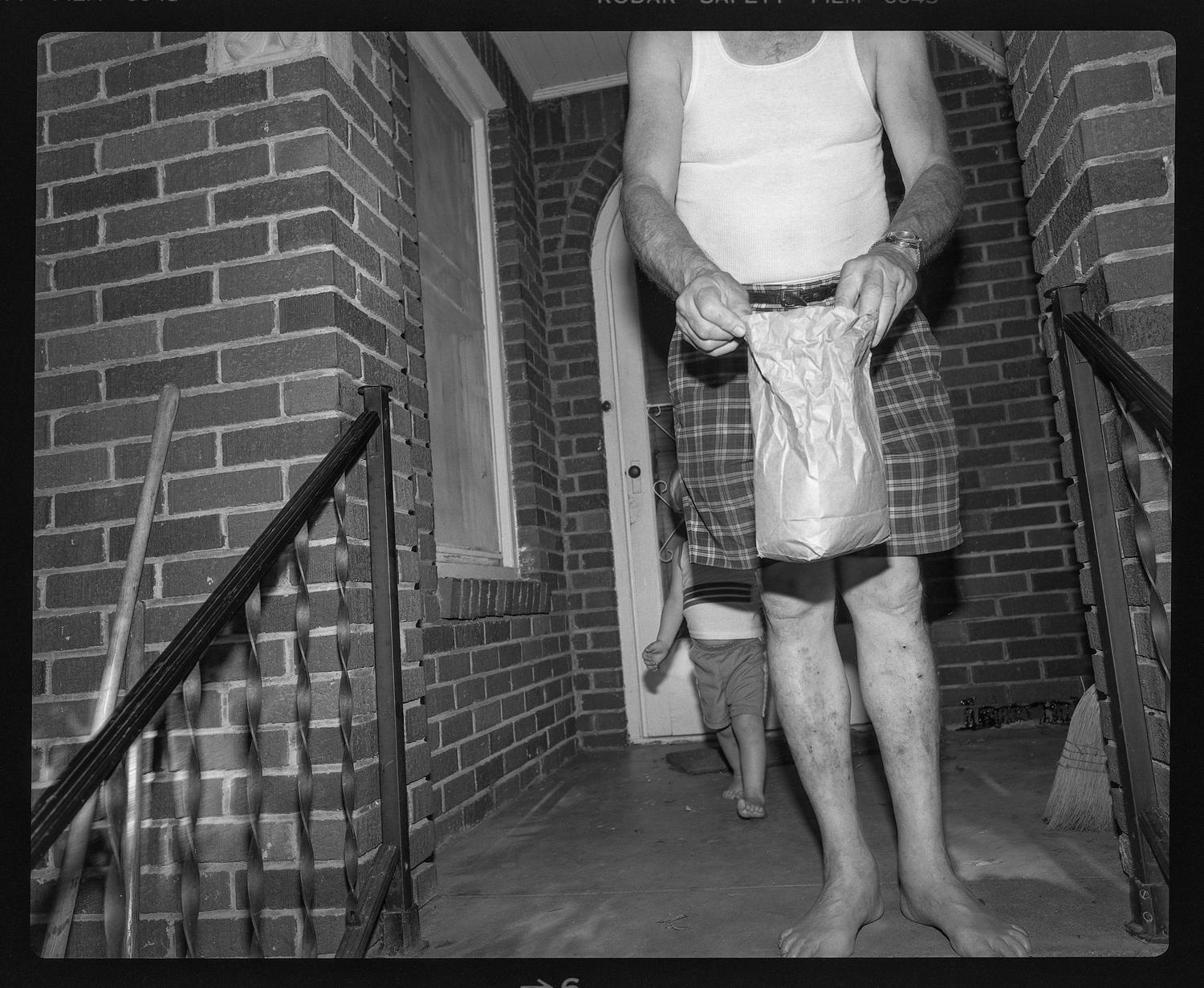 [Man and toddler on a front porch]
                                                
                                                    [Sequence #]: 1 of 1
                                                