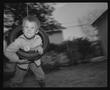 Photograph: [Jack in Tire Swing, 1987]
