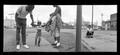 Photograph: [Jefferson Blvd Panoramic Family with Child, 1988]