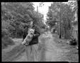 Photograph: [Man with Dog in Alley, 1988]