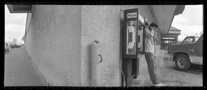 Primary view of object titled '[Man on Payphone Jefferson Blvd Panoramic, 1988]'.