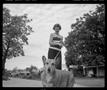Photograph: [Lady with Dog on Leash 1985]