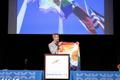 Thumbnail image of item number 1 in: '[Chad West presenting Dallas rainbow flag]'.