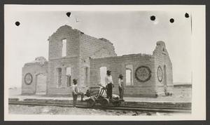 Primary view of object titled '[A damaged building in Saucillo, Chihuahua]'.