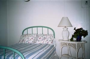 Primary view of object titled '[A bedroom at the Guest House]'.