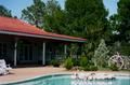 Photograph: [An outdoor patio area and pool at Healing Springs Ranch, 1]