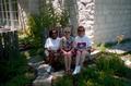 Photograph: [Three women sitting outside at Roadrunner Farm]