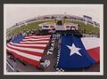 Thumbnail image of item number 1 in: '[The United States and Texas State flags being unfurled]'.
