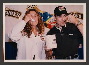 Primary view of object titled '[Angie Athanas (left) and Jeff Gordon (right) eating "Jeff's Mint Chocolate Speedway" ice cream]'.