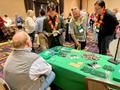 Thumbnail image of item number 1 in: '[Guests visiting UNT's Department of Learning Technologies table]'.