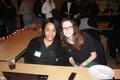 Photograph: [Two UNT Staff Members Smile at Table]