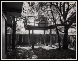 Primary view of object titled '[A backyard with a tree house and play area]'.