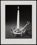 Photograph: [A lit candle in a dish]
