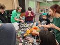 Photograph: [Large group decorating their library pumpkin, 2]