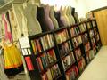 Primary view of [Shelf of books and mannequins]