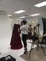 Photograph: [Sheryl Lanzel photographing the back of an haute couture dress]
