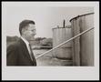 Photograph: [Man in a Suit in an Oil Field, 2]