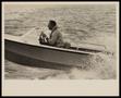 Photograph: [Man Driving Speed Boat, 2]