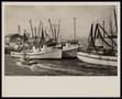 Photograph: [Men and Woman on Boat near Fishing Boats - Louise Crawford, Kathy An…