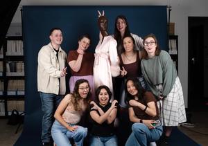 [Group portrait of Texas Fashion Collection's staff acting silly]