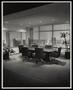 Photograph: [An oval-shaped table and six chairs in an office space]