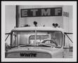 Photograph: [A man driving an East Texas Motor Freight vehicle]