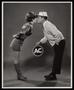 Photograph: [A man and woman kissing in an AC advertisement]