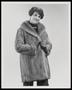 Photograph: [A woman in a fur coat and gloves]