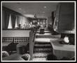 Photograph: [Interior of a restaurant with a fireplace and carpeting]