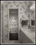 Primary view of [A bathroom and bedroom with floral wallpaper]