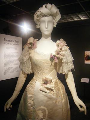 Primary view of object titled '[An 1890s white dress with light pink silk flowers]'.