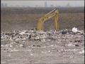Primary view of [News Clip: Garbage pits]