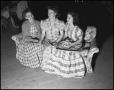 Photograph: [Three women sitting on a couch]