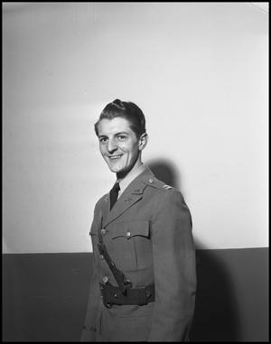 Primary view of object titled '[Earl Connette Posing for a Photograph in a Military Uniform]'.