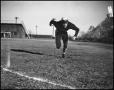 Photograph: [Football Player Running on the Field]
