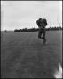 Photograph: [Football Player No. 43 Clutching a Football, September 1962]