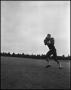 Photograph: [Football Player No. 86 Running with a Football, September 1962]