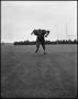 Photograph: [Football Player No. 51 Running in a Blocking Position, September 196…