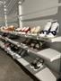 Primary view of [Shoes mounted with board and foam sitting on shelves]