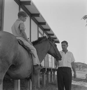 Primary view of object titled '[Danny Citron on a horse held by Dr. Ralph Citron, 1]'.