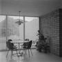 Photograph: [A table with four chairs before windows, 1]