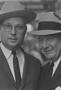 Photograph: [Close-up of two men in suits and hats, 6]