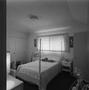Photograph: [A bedroom with pale furniture, 3]