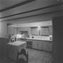 Photograph: [A kitchen with wooden cabinets, 3]