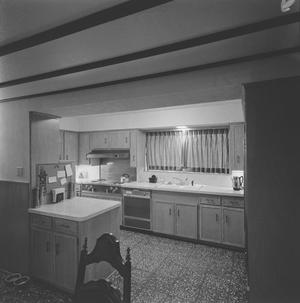 Primary view of object titled '[A kitchen with wooden cabinets, 2]'.