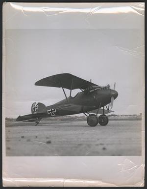 Primary view of object titled '[Red Bi-Plane with a Black Iron Cross]'.