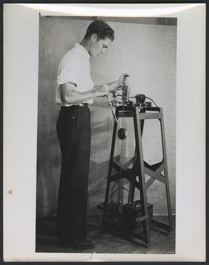 Primary view of object titled '[Unidentified man working on a propeller blade, 3]'.