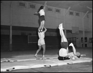 Primary view of object titled '[Women's Gymnastics students practicing stunts, 1942]'.