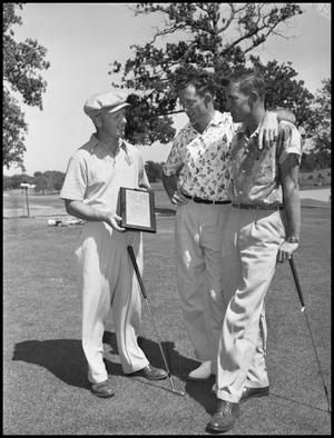 Primary view of object titled '[Golfers with trophy]'.